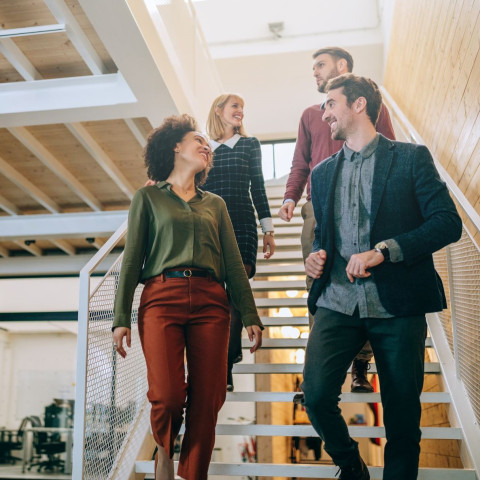 People laughing and working together