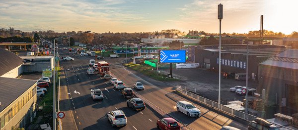 VAST billboard alongside a busy highway